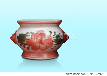 white and orange ceramic pot on blue background, object, decor, gift, copy space white and orange ceramic pot on blue background, object, decor, gift, copy space 94052925