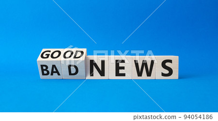 Good news and Bad news symbol. Turned wooden cubes with words Good news and Bad news. Beautiful blue background. Business concept. Copy space 94054186