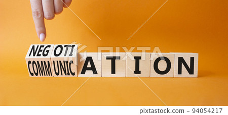 Negotiation vs Communication symbol. Businessman hand turns a cube and changes words Negotiation to Communication. Beautiful orange background. Business concept. Copy space Negotiation vs Communication symbol. Businessman hand turns a cube and changes words Negotiation to Communication. Beautiful orange background. Business concept. Copy space 94054217