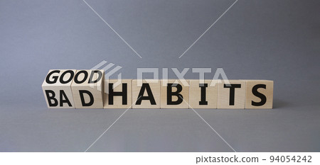 Good and bad Habits symbol. Turned wooden cubes with words Bad Habits and Good Habits. Beautiful grey background. Medicine concept. Copy space Good and bad Habits symbol. Turned wooden cubes with words Bad Habits and Good Habits. Beautiful grey background. Medicine concept. Copy space 94054242
