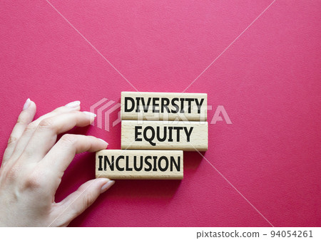 Diversity Equity Inclusion symbol. Concept words Diversity Equity Inclusion on wooden blocks. Beautiful red background. Bisinessman hand. Business and Diversity Equity Inclusion concept. Copy space 94054261
