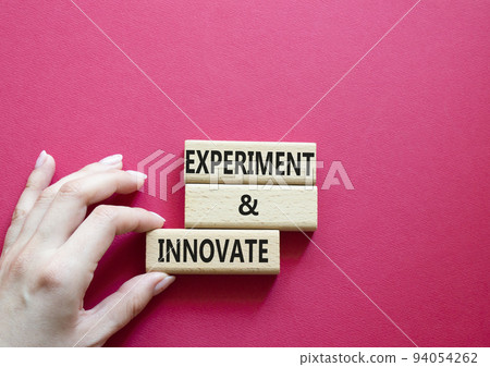Experiment and innovate symbol. Concept words Experiment and innovate on wooden blocks. Beautiful red background. Businessman hand. Business and Experiment and innovate concept. Copy space. Experiment and innovate symbol. Concept words Experiment and innovate on wooden blocks. Beautiful red background. Businessman hand. Business and Experiment and innovate concept. Copy space. 94054262
