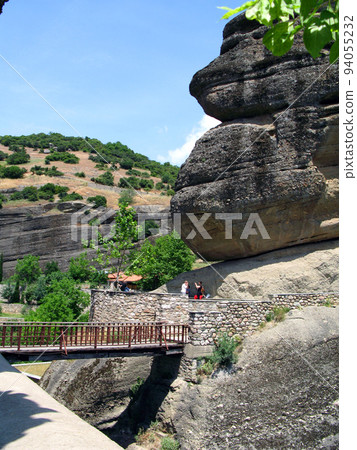 Panoramic view from Holy Trinity Monastery of Meteora in Greece high in the mountains. Unusual architecture. Panoramic view from Holy Trinity Monastery of Meteora in Greece high in the mountains. Unusual architecture. 94055232