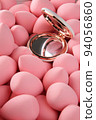 beauty background a bunch of pink gentle makeup sponges and a mirror vertical orientation 94056860