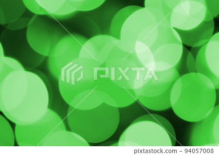 Green abstract Christmas blurred luminous background. Defocused artistic bokeh lights image Green abstract Christmas blurred luminous background. Defocused artistic bokeh lights image 94057008