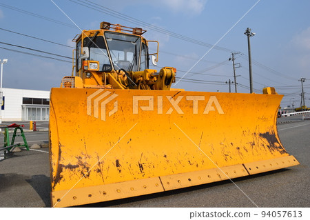 Snowplow waiting in a snowy country Snowplow waiting in a snowy country 94057613