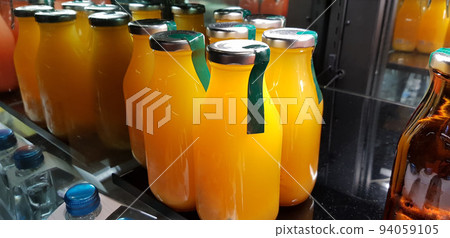 orange juice, mix fruit juice and apple juice inside the display fridge orange juice, mix fruit juice and apple juice inside the display fridge 94059105