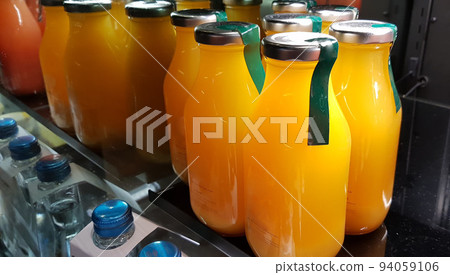 orange juice, mix fruit juice and apple juice inside the display fridge 94059106