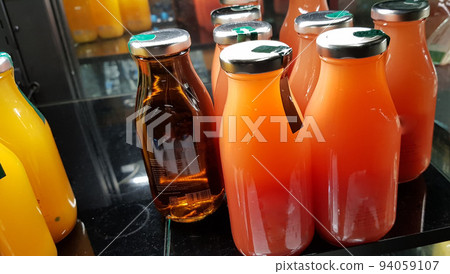 orange juice, mix fruit juice and apple juice inside the display fridge orange juice, mix fruit juice and apple juice inside the display fridge 94059107