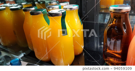 orange juice, mix fruit juice and apple juice inside the display fridge 94059109