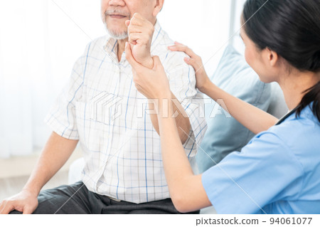 Caring young female doctor working with senior patient contented senior patient. 94061077