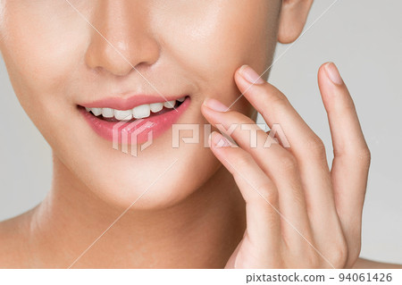 Closeup ardent young woman posing beauty gesture with clean fresh skin. 94061426