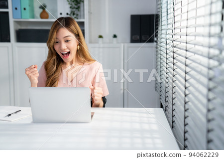 A young female employee receives a promotion for being a competent worker. 94062229