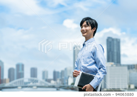Young businessman walking in a Y-shirt Young businessman walking in a Y-shirt 94063880