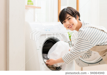 Young woman doing laundry Parts Young woman doing laundry Parts 94064940