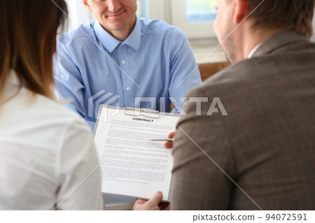 Married couple signs contract to buy house from male realtor or broker 94072591