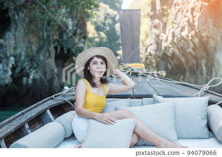 Woman tourist in private longtail boat trip to Lagoon koh hong near Hong island, Krabi, Thailand. landmark, destination, Asia Travel, vacation, wanderlust and holiday concept 94079066