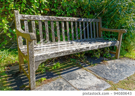 Rustic wooden garden bench seat - Tintagel - Cornwall UK Rustic wooden garden bench seat - Tintagel - Cornwall UK 94080643