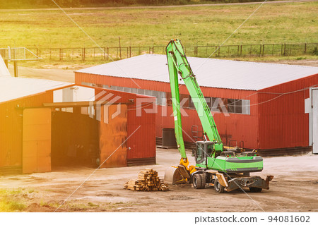 Loading Stack Of Timber. Woodworking Plant. Wood Stacks Waiting For Processing. Wood Processing Industry. Industrial, Infrastructure Theme. Machines, Mechanisms 94081602