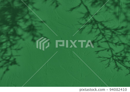 Fir tree shadows on dark green concrete wall texture background Fir tree shadows on dark green concrete wall texture background 94082410