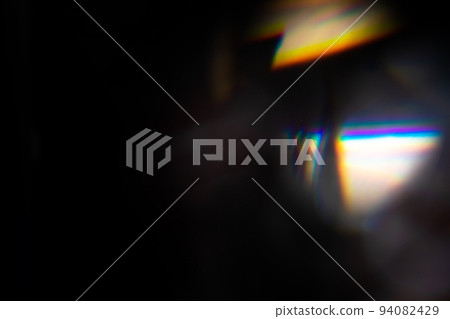 colorful rainbow crystal light leaks on black background 94082429