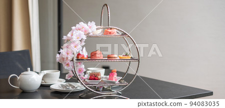 Afternoon tea set and Pink dessert at luxury hotel Afternoon tea set and Pink dessert at luxury hotel 94083035