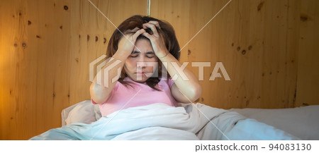 woman having migraine headaches during lying in bed at home. insomnia, sleepless, tired, suffering and stressed concepts woman having migraine headaches during lying in bed at home. insomnia, sleepless, tired, suffering and stressed concepts 94083130
