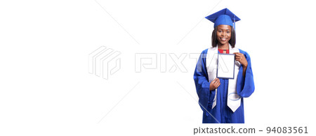 Banner. A university student in a graduation gown and hat, holding a diploma certificate in his hands, standing isolated on a white background. The concept of education. High quality photo 94083561