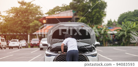 man driver standing near a problem car. Breakdown or broken car on road. Vehicle Insurance, maintenance and service concept 94083593