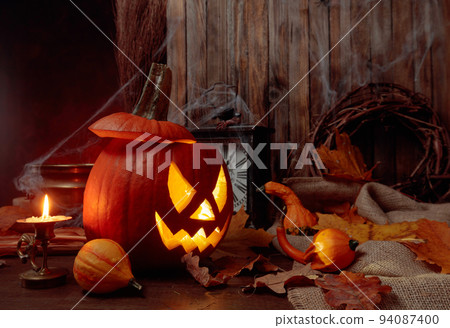 Halloween pumpkins on a old wooden background. Conceptual still life on the theme of Halloween. Halloween pumpkins on a old wooden background. Conceptual still life on the theme of Halloween. 94087400