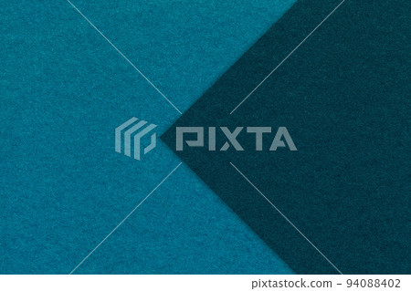 Texture of dark turquoise paper background, half two colors with navy blue arrow, macro. Craft cerulean cardboard. Texture of dark turquoise paper background, half two colors with navy blue arrow, macro. Craft cerulean cardboard. 94088402