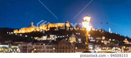 Tbilisi, Georgia Scenic Panoramic View Of Impregnable Fortress Narikala Fortress. Night Boke Bokeh Blurred Ancient Fortress Narikala In Old Town Of Tbilisi. Caucasus. Abstract Blurred Bokeh Tbilisi, Georgia Scenic Panoramic View Of Impregnable Fortress Narikala Fortress. Night Boke Bokeh Blurred Ancient Fortress Narikala In Old Town Of Tbilisi. Caucasus. Abstract Blurred Bokeh 94089153
