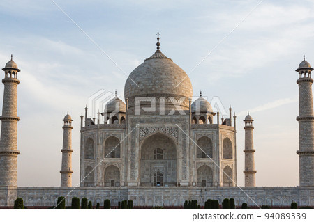 Tomb and minaret made of marble of Taj Mahal in Agra, India 94089339