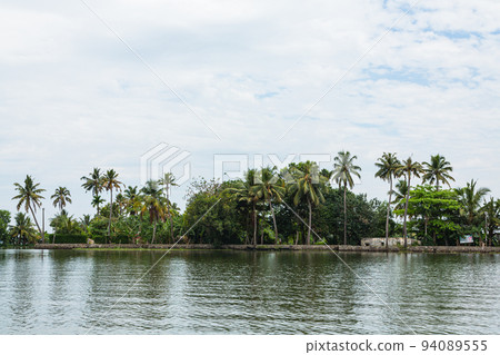 Scenery of backwater cruising on Vembanad Lake in Alappuzha, Kerala, India Scenery of backwater cruising on Vembanad Lake in Alappuzha, Kerala, India 94089555