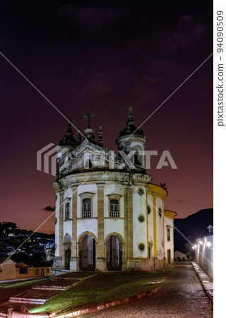Old baroque church illuminated at dusk in Ouro Preto Old baroque church illuminated at dusk in Ouro Preto 94090509