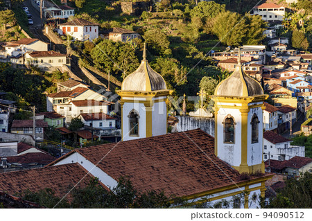 Towers and bells of an old baroque church in Ouro Preto 94090512