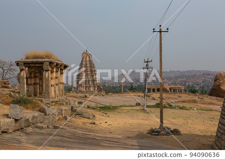 Pagoda and ruins of Virupaksha temple, one of the group of buildings in Hampi, India 94090636