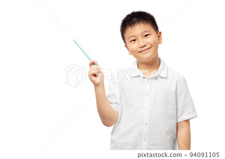 Smiling kid holding pencil and pointing to the left isolated on white background Smiling kid holding pencil and pointing to the left isolated on white background 94091105
