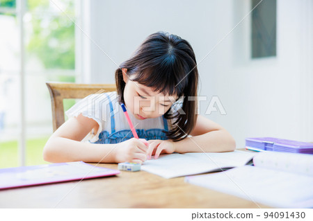 Elementary school girl studying at home 94091430