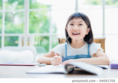 Elementary school girl studying at home 94091708
