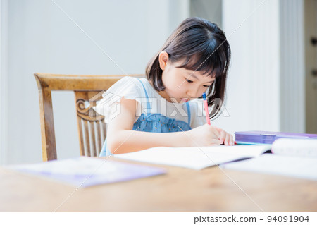 Elementary school girl studying at home 94091904