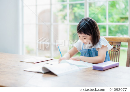 Elementary school girl studying at home 94092077