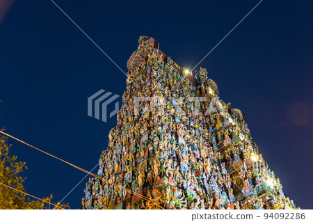 Illuminated West Gate of Meenakshi Temple in Madurai, India 94092286
