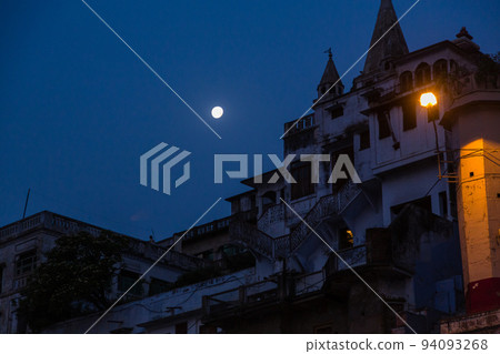 Cityscape along the Ganges River in Varanasi, India at night Cityscape along the Ganges River in Varanasi, India at night 94093268