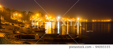 Night view along the holy Ganges river in Varanasi, India Night view along the holy Ganges river in Varanasi, India 94093335