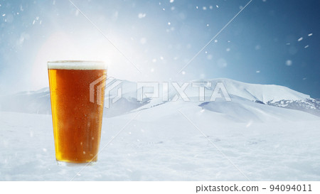 Poster with glass of light cold foamy beer over snow-capped mountains background. Holidays, vacation, drinks, taste, ad and oktoberfest concept Poster with glass of light cold foamy beer over snow-capped mountains background. Holidays, vacation, drinks, taste, ad and oktoberfest concept 94094011