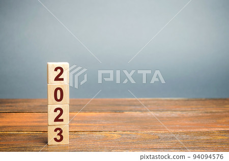 Wooden blocks with the inscription 2023. Setting goals and objectives for the new year. Planning, business management and strategy concept. Trends and ideas. Vision. Wooden blocks with the inscription 2023. Setting goals and objectives for the new year. Planning, business management and strategy concept. Trends and ideas. Vision. 94094576