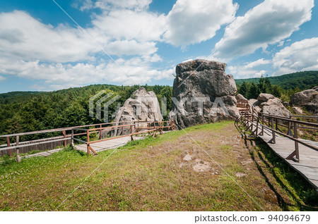 Remains of the rocks of the city of Tustan fortress in the Carpathian mountains Remains of the rocks of the city of Tustan fortress in the Carpathian mountains 94094679