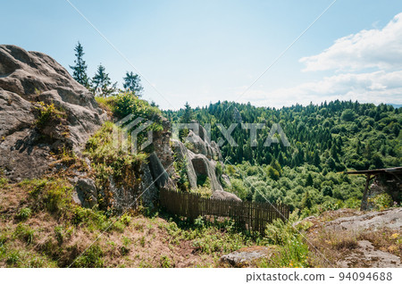 Remains of the rocks of the city of Tustan fortress in the Carpathian mountains 94094688