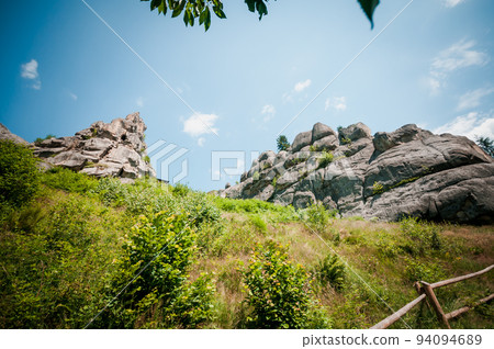 Remains of the rocks of the city of Tustan fortress in the Carpathian mountains 94094689